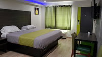Exclusivo Inn and Suites Accommodation Rooms
